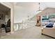 Cozy loft space with carpeted floors, neutral paint and seating with natural lighting and modern fixtures at 829 Pioneer Woods Dr, Indianapolis, IN 46224