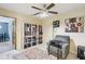 Home office featuring a bookcase, comfortable chair and colorful accent rug at 829 Pioneer Woods Dr, Indianapolis, IN 46224