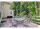 Patio with a round table and four chairs, perfect for outdoor dining at 829 Pioneer Woods Dr, Indianapolis, IN 46224