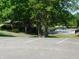 View of community amenities including a pool, playground, and ample parking at 8425 E 82Nd E St, Indianapolis, IN 46256