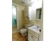 A bathroom featuring a white vanity, tile floor, toilet, and a linen closet at 8425 E 82Nd E St, Indianapolis, IN 46256