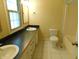 A bathroom with a double vanity, toilet, tub and shower with a window offering natural light at 8425 E 82Nd E St, Indianapolis, IN 46256