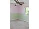 Bedroom showing a ceiling fan, a window and 2-toned painted walls with carpeting at 8425 E 82Nd E St, Indianapolis, IN 46256