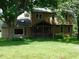 Charming two-story home with a covered porch and well-maintained lawn at 8425 E 82Nd E St, Indianapolis, IN 46256