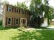 Charming home with red shutters, front garden area, and a classic design at 8425 E 82Nd E St, Indianapolis, IN 46256