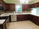 Bright kitchen with stainless steel appliances, tiled backsplash, and ample counter space at 8425 E 82Nd E St, Indianapolis, IN 46256