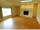 Bright living room with hardwood floors, skylight and traditional brick fireplace at 8425 E 82Nd E St, Indianapolis, IN 46256