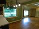 Open living area with hardwood floors, fireplace and view to the outside at 8425 E 82Nd E St, Indianapolis, IN 46256