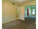 Comfortable carpeted living room featuring stylish wainscoting and entrances to other rooms at 8425 E 82Nd E St, Indianapolis, IN 46256