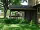 Inviting covered porch with ornate details, perfect for relaxing and enjoying the outdoors at 8425 E 82Nd E St, Indianapolis, IN 46256