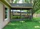 Relaxing covered porch with wood railing and a view of the fenced-in backyard at 8425 E 82Nd E St, Indianapolis, IN 46256