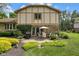 Secluded backyard featuring a stone patio with outdoor seating and professional landscaping at 8525 Winding Ridge Rd, Indianapolis, IN 46217