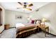 Cozy bedroom with soft carpet, warm lighting, and a ceiling fan for comfortable living at 8525 Winding Ridge Rd, Indianapolis, IN 46217
