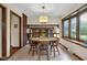 Inviting dining room with a round table, and natural light, and fireplace views at 8525 Winding Ridge Rd, Indianapolis, IN 46217