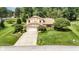 Charming two-story home with a well-maintained lawn and beautiful landscaping at 8525 Winding Ridge Rd, Indianapolis, IN 46217
