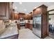 Well-equipped kitchen with stainless steel appliances, granite countertops, and ample cabinetry at 8525 Winding Ridge Rd, Indianapolis, IN 46217