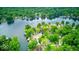 Aerial view of lakefront homes surrounded by lush greenery at 8635 S Providence Dr, Nineveh, IN 46164