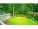 The backyard shows a deck with seating and stairs to a lake at 8635 S Providence Dr, Nineveh, IN 46164