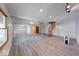 Spacious basement with laminate flooring, white walls, exposed wood beam and unique spiral staircase at 8635 S Providence Dr, Nineveh, IN 46164