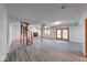 Large basement with laminate flooring, fireplace, unique spiral staircase, and double doors to the outside at 8635 S Providence Dr, Nineveh, IN 46164