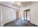 Bright bedroom with vaulted ceiling, wooden doors, and plush gray carpeting at 8635 S Providence Dr, Nineveh, IN 46164