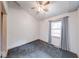 Bedroom with vaulted ceiling, neutral carpet and paint, and a single window at 8635 S Providence Dr, Nineveh, IN 46164
