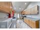 Bright kitchen with natural wood cabinets, gray countertops and stainless steel appliances at 8635 S Providence Dr, Nineveh, IN 46164