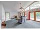 Spacious living room with vaulted ceiling, fireplace, and lake view at 8635 S Providence Dr, Nineveh, IN 46164