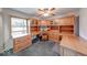 Home office space featuring wood cabinets, shelving, and a built-in desk at 8635 S Providence Dr, Nineveh, IN 46164
