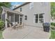 Backyard patio features an outdoor dining set and grill at 9643 Cypress Way, Carmel, IN 46032