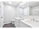 Bright bathroom features double sinks, a large mirror, and a modern shower at 9643 Cypress Way, Carmel, IN 46032