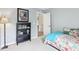 Comfortable bedroom with soft colors, carpet flooring, and natural light, ideal for a restful retreat after a long day at 9643 Cypress Way, Carmel, IN 46032