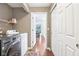 Well-equipped laundry room with modern appliances, shelving, and a convenient layout, making laundry a breeze at 9643 Cypress Way, Carmel, IN 46032
