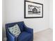 Comfortable sitting area features an accent chair and stylish framed artwork at 9643 Cypress Way, Carmel, IN 46032