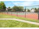 View of a community tennis court surrounded by green space, providing a great recreational amenity at 9643 Cypress Way, Carmel, IN 46032