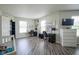 Bonus room featuring multiple desks, laminate flooring, natural light, and flexible space for work or relaxation at 9775 Big Bend Dr, Indianapolis, IN 46234