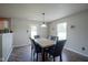 The dining room is bright with natural light, offering seating for six and stylish laminate wood flooring at 9775 Big Bend Dr, Indianapolis, IN 46234
