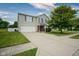 Inviting two-story home with a well-manicured lawn and an attached two-car garage at 9775 Big Bend Dr, Indianapolis, IN 46234