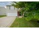 Inviting two-story home featuring an attached garage, well-manicured lawn, and charming front entrance at 9775 Big Bend Dr, Indianapolis, IN 46234