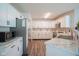 Bright kitchen featuring stainless steel appliances, marble counters, and modern cabinets at 9775 Big Bend Dr, Indianapolis, IN 46234