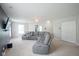 Spacious living room with plush sectional sofa, neutral carpeting, and ample space for relaxation and entertainment at 9775 Big Bend Dr, Indianapolis, IN 46234