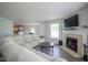 Cozy living room featuring a fireplace, comfortable seating, and an open-concept design at 9775 Big Bend Dr, Indianapolis, IN 46234