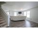 Spacious living room with ample natural light, a fireplace, and stylish flooring at 9775 Big Bend Dr, Indianapolis, IN 46234
