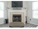 Inviting living room features a fireplace, large windows, and modern decor at 9775 Big Bend Dr, Indianapolis, IN 46234
