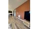 Textured accent wall adds visual interest in an open living space with connection to kitchen at 10218 Arctic Edge Dr, Indianapolis, IN 46259
