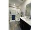 Bathroom featuring a shower with glass doors, neutral color palette, and practical design at 10218 Arctic Edge Dr, Indianapolis, IN 46259