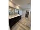 Bathroom showcasing a dual sink vanity, large mirror, shower, closet, and modern grey flooring at 10218 Arctic Edge Dr, Indianapolis, IN 46259