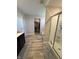 Bathroom featuring a shower, bathtub, closet, and modern gray tiling with plenty of floor space at 10218 Arctic Edge Dr, Indianapolis, IN 46259
