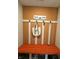 A vibrant entryway with a bench, coat rack, decorative hooks, and 'HOME' sign adding character and function at 10218 Arctic Edge Dr, Indianapolis, IN 46259