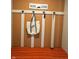 A vibrant entryway with a bench, coat rack, decorative hooks, and 'HOME' sign adding character and function at 10218 Arctic Edge Dr, Indianapolis, IN 46259